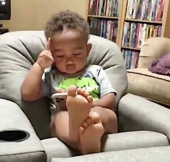 Kid Watching Phone And Thinking